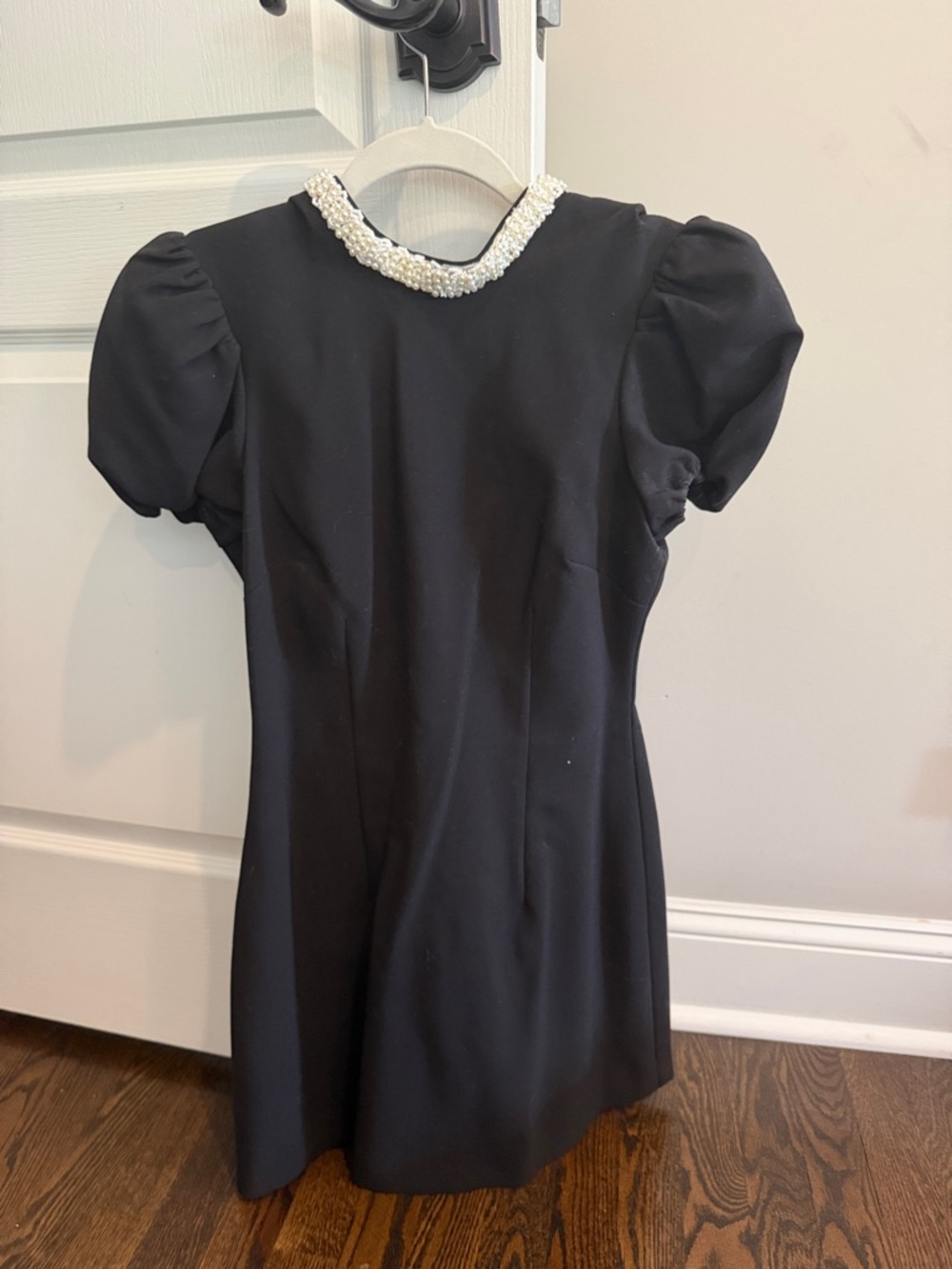 Likely Black Dress with Pearl Collar and Puff Sleeves